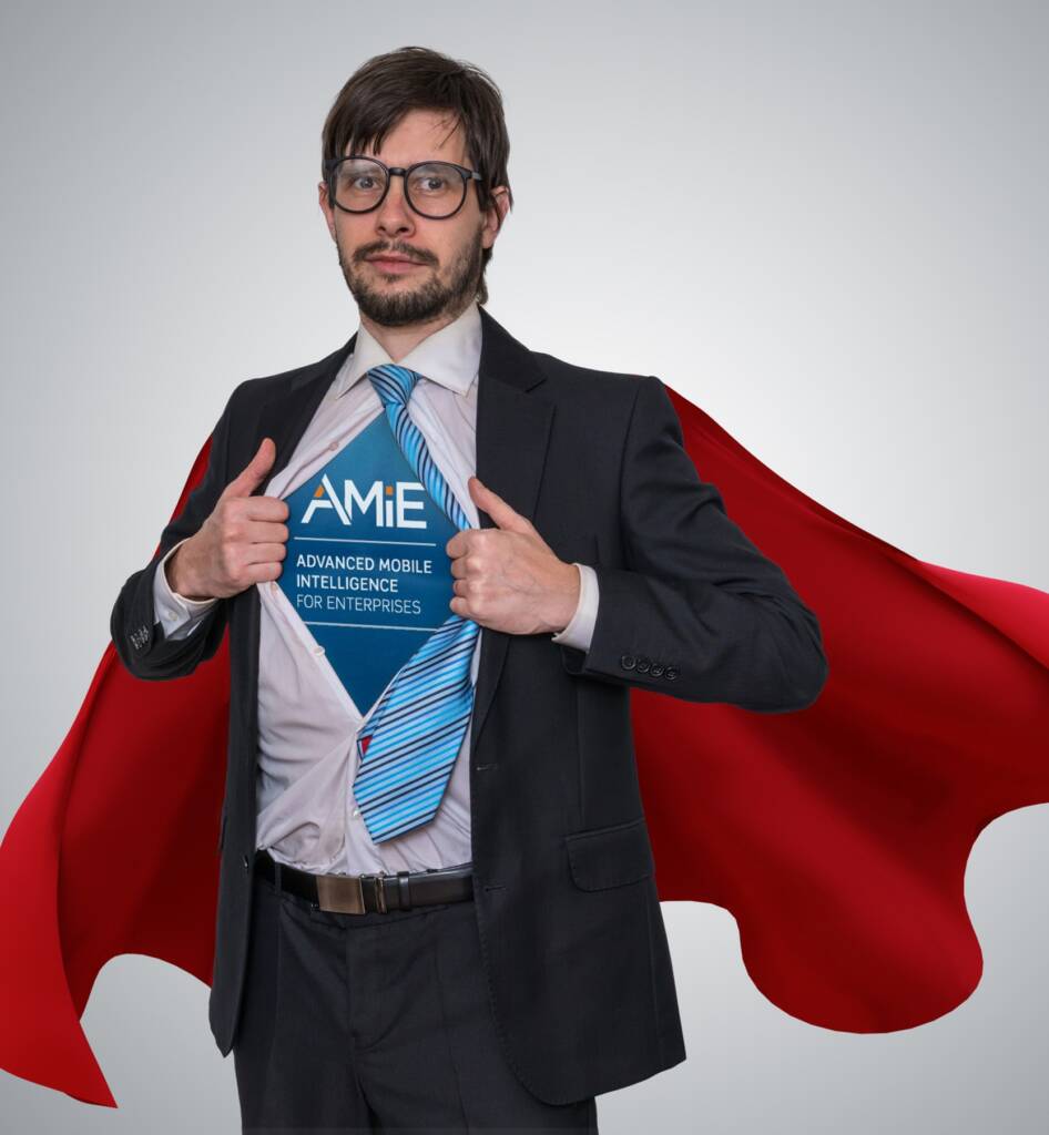 Man with cape wearing AMIE shirt under suit