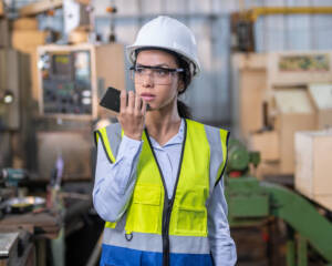 female manufacturing worker on Versity 97 showing how Integrated PTT Drives Speed, Safety, and Simplicity